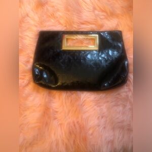Michael Kors Monogram Clutch Bag.